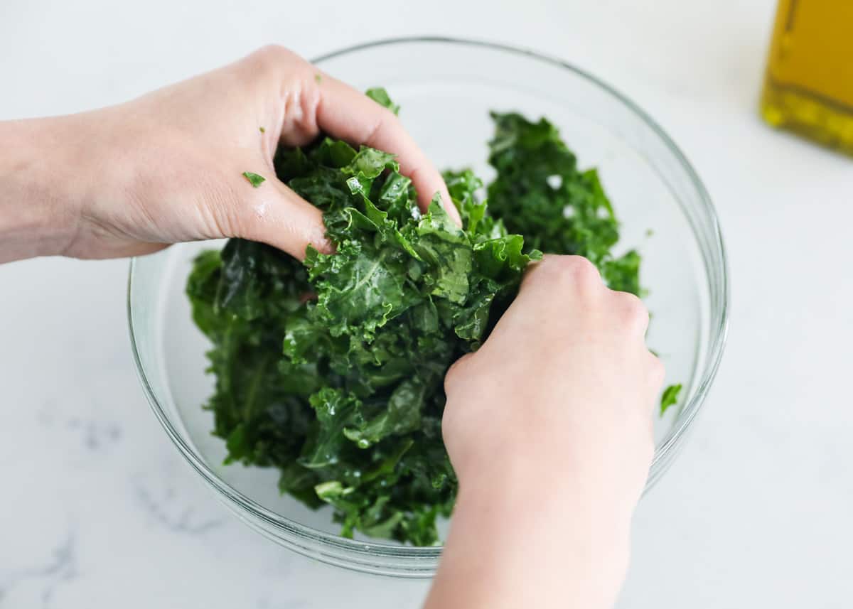 Kale and oil in bowl.