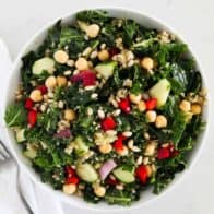 kale quinoa salad in white bowl