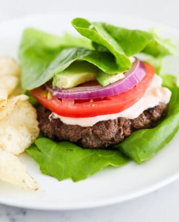 lettuce wrap burger on white plate