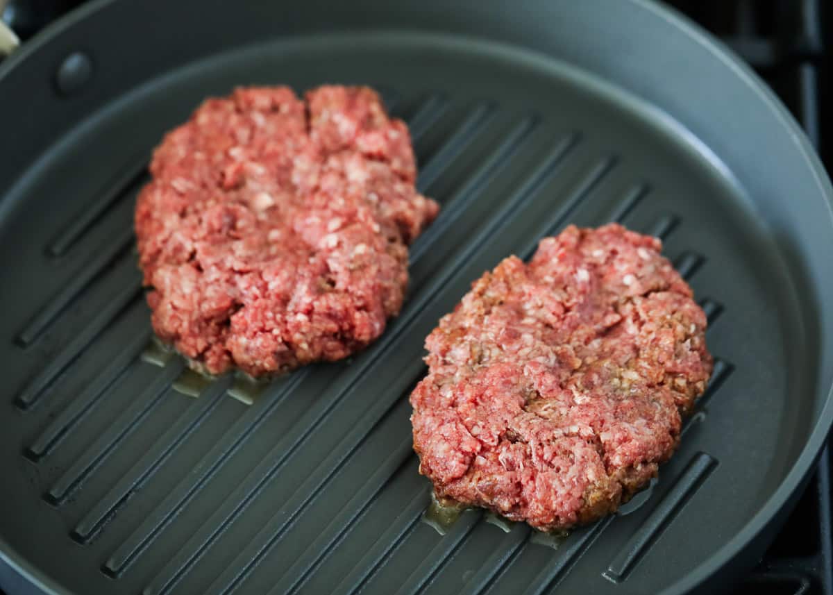 Burger patties on pan.