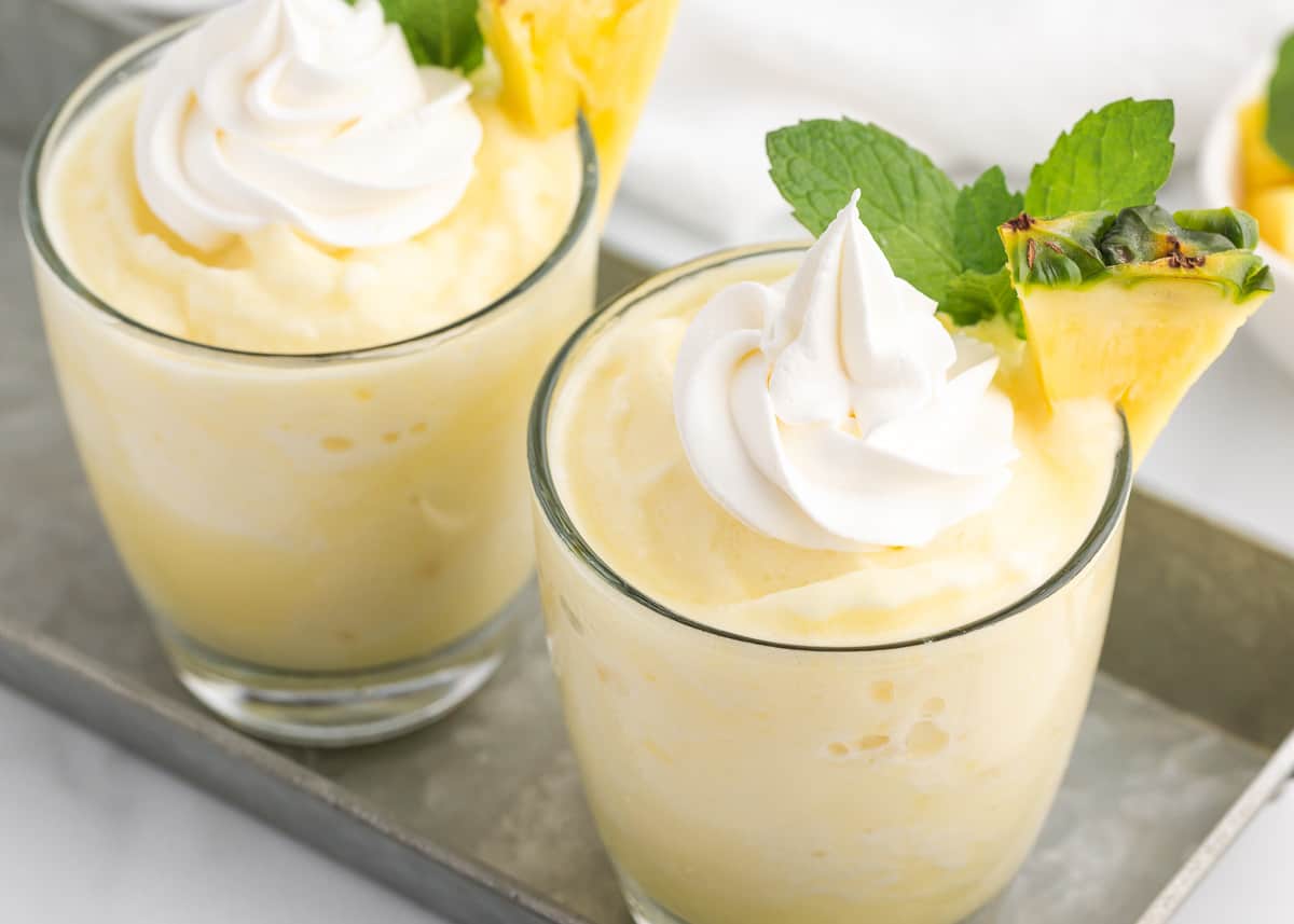 Pina colada smoothies in clear glasses.