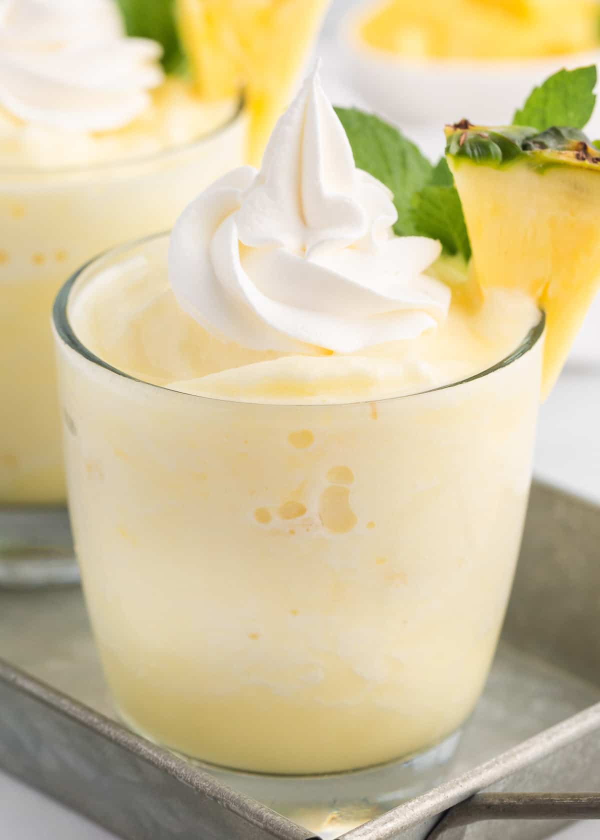 Pina colada smoothies in clear glasses.