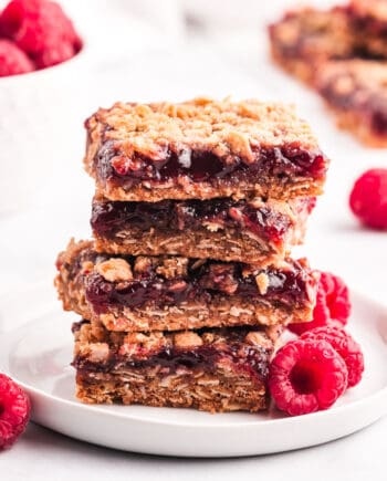 raspberry crumb bars on white plate