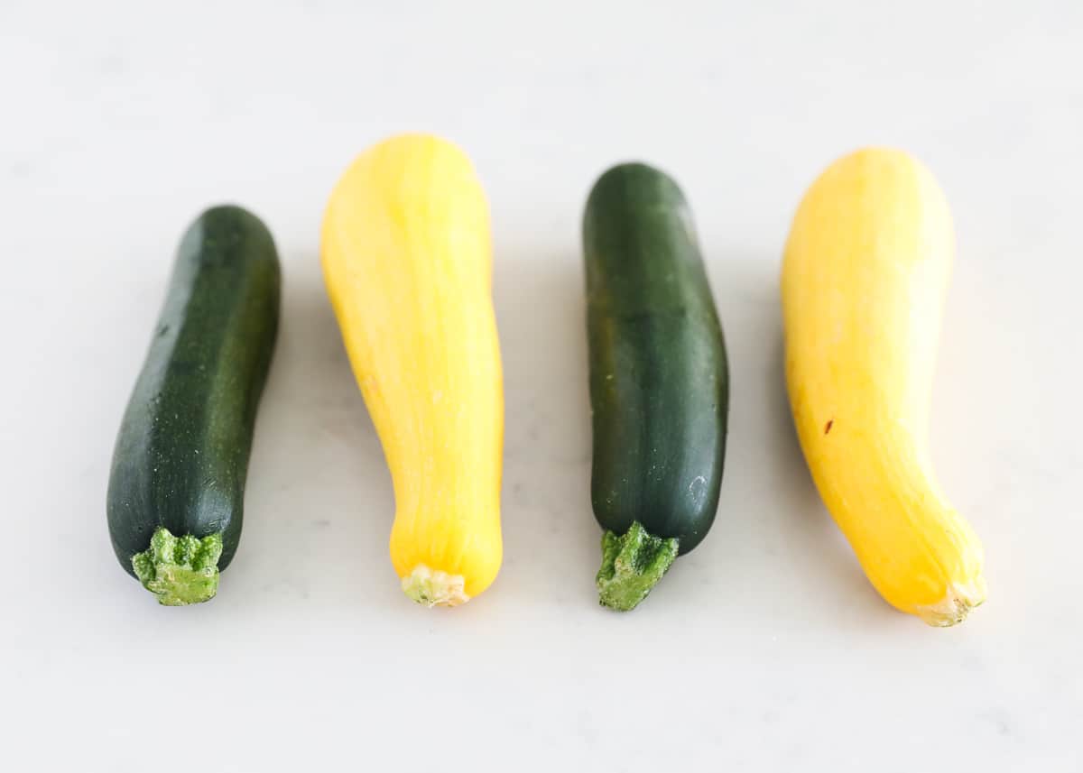 Zucchini and squash on table.