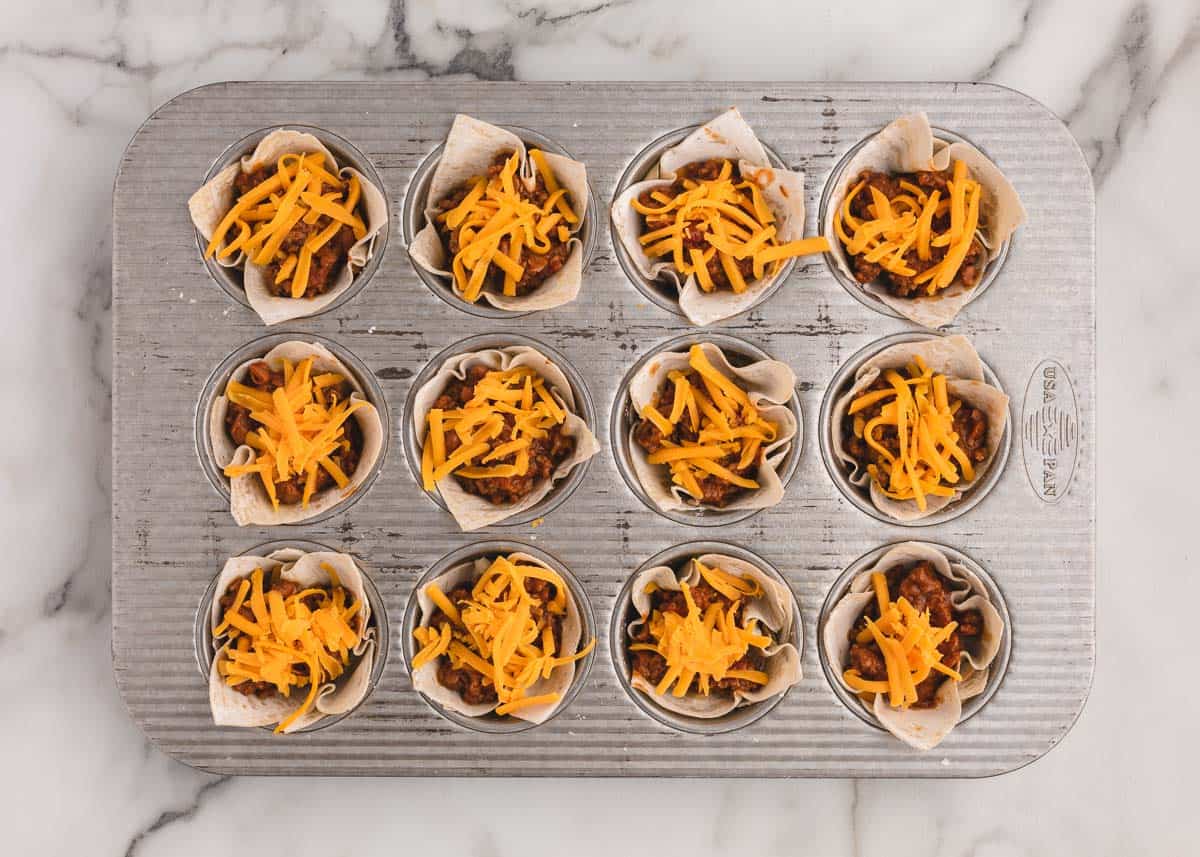 Taco cups in muffin pan.