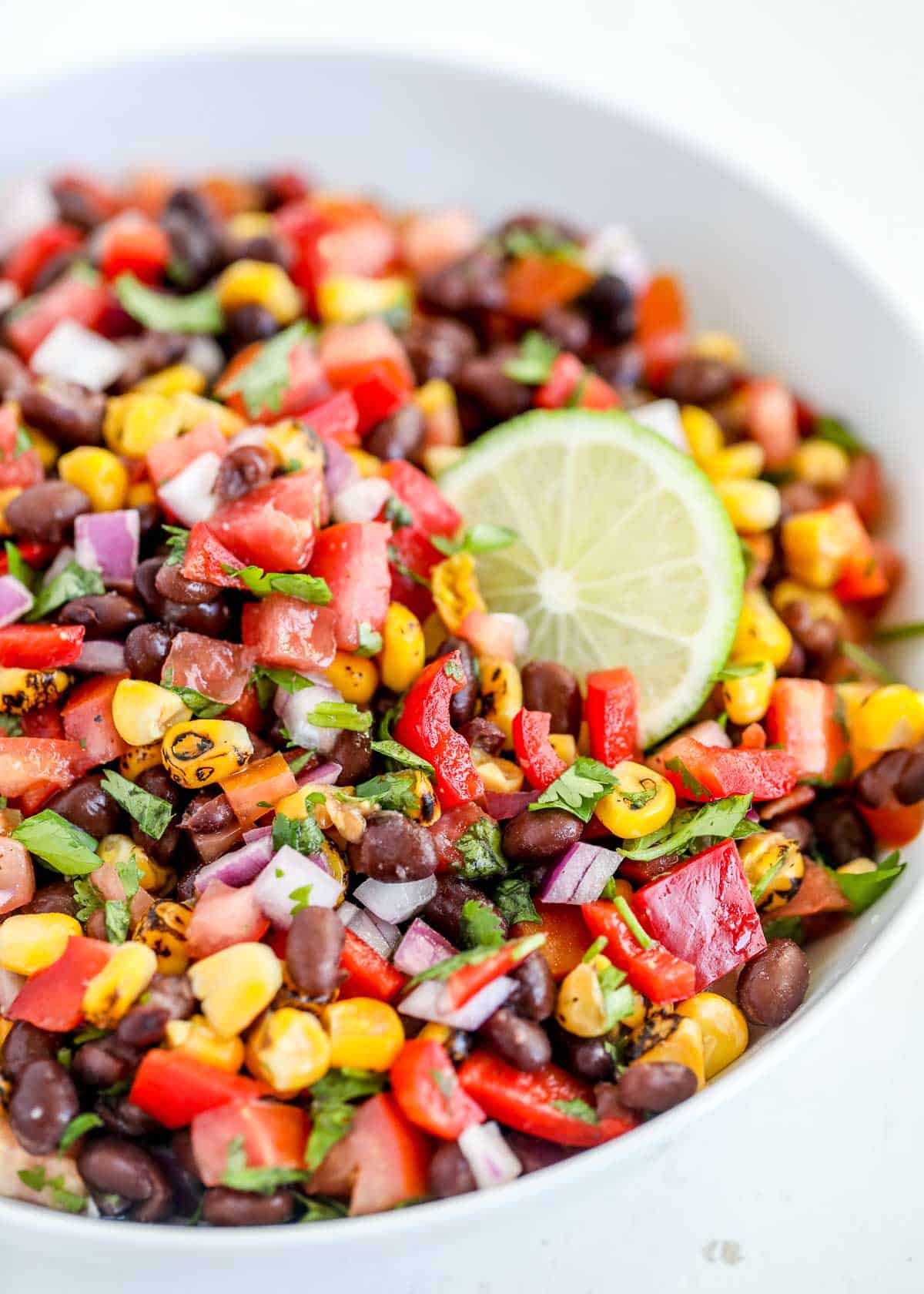 Black bean salsa in white bowl.