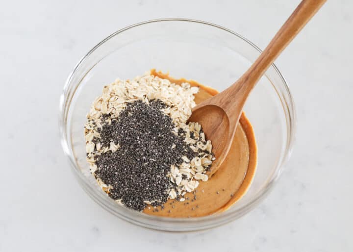 These no-bake breakfast cookies are easy to make, healthy, packed with protein and simply delicious. They can be whipped up in less than 5 minutes and stored for up to two weeks. peanut butter, oats and chia seeds in bowl