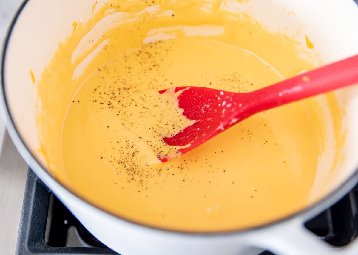 mixing cheese dip with spoon