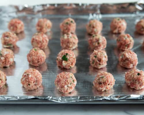 raw meatballs on pan