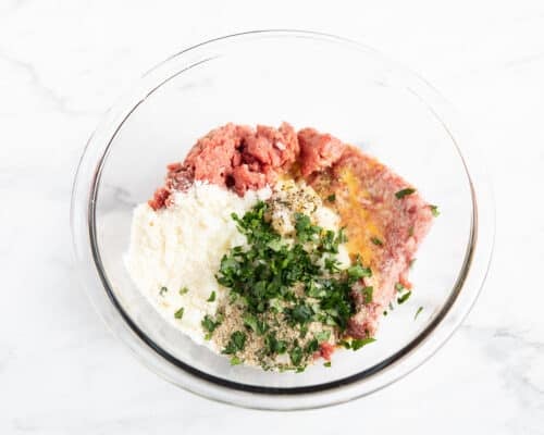 meatball ingredients in glass bowl