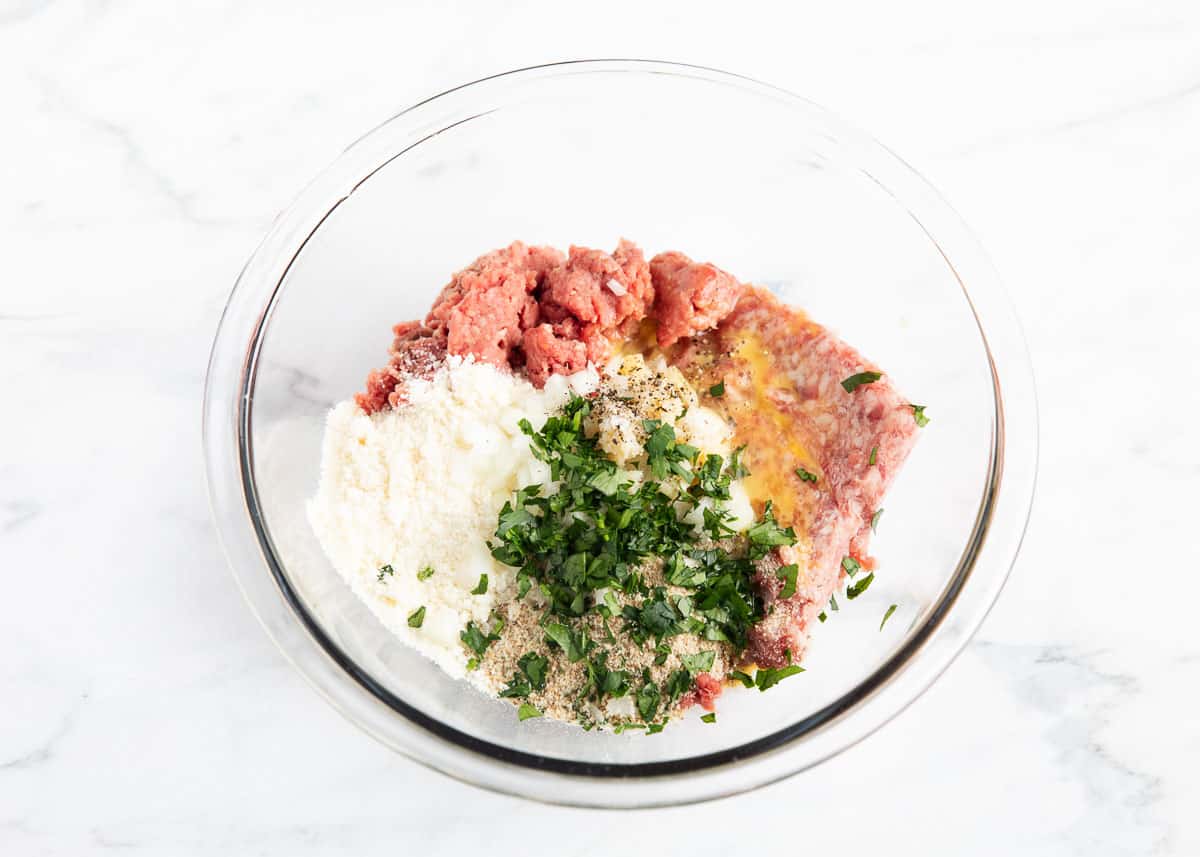 meatball ingredients in glass bowl