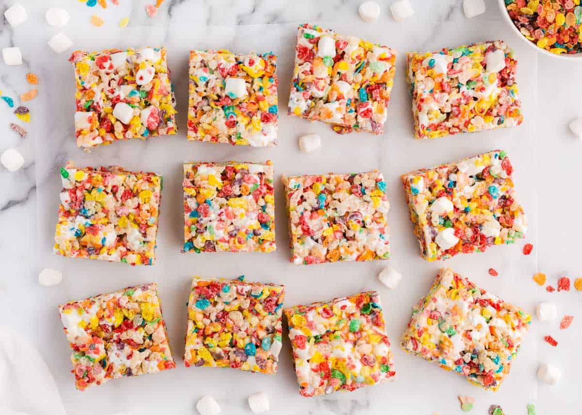 Sliced fruity pebbles treats on counter.