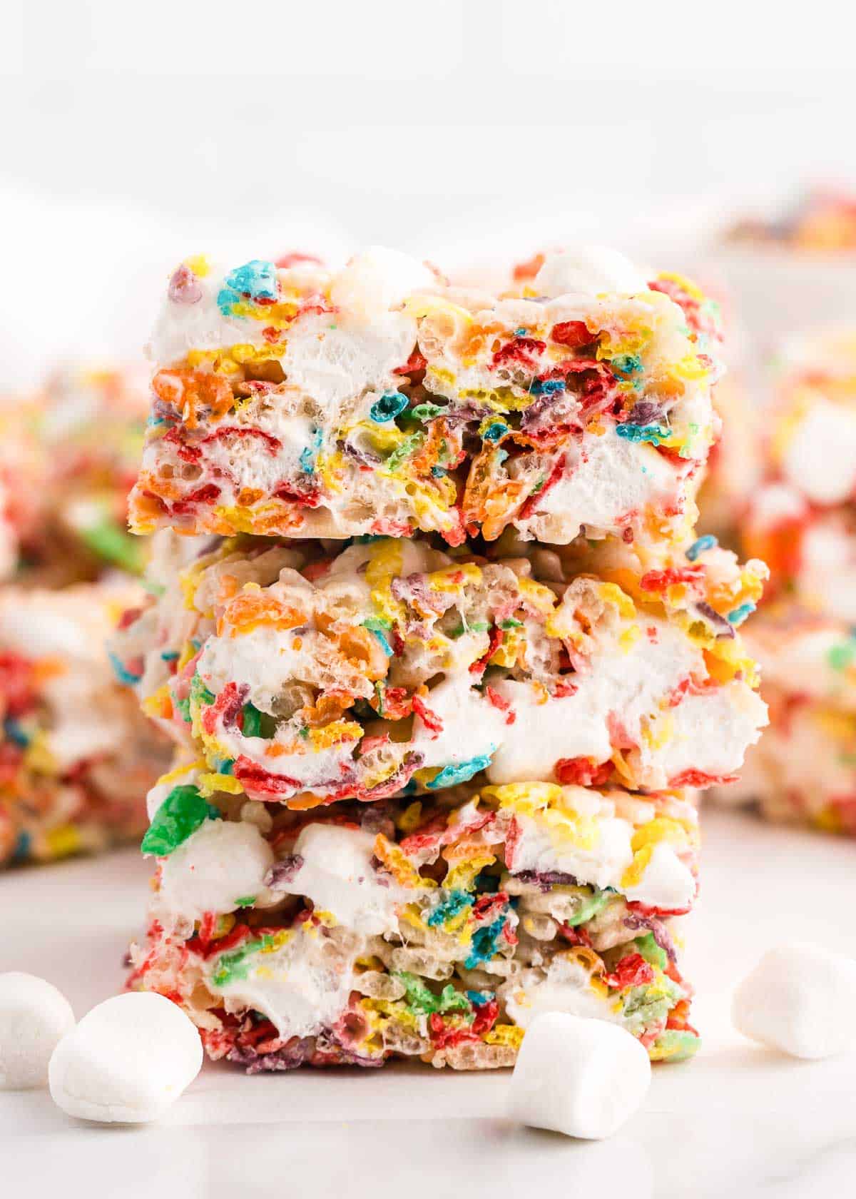 Stacked fruity pebbles treats.