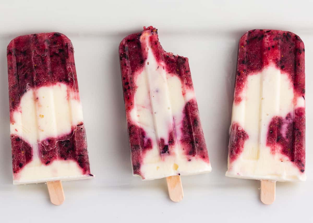 Popsicles on white plate.