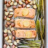 Salmon, potatoes and asparagus on sheet pan.