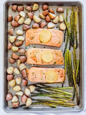 Salmon, potatoes and asparagus on sheet pan.