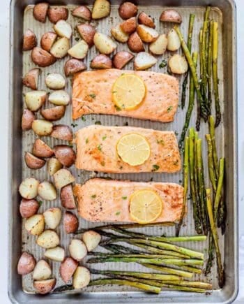 Salmon, potatoes and asparagus on sheet pan.