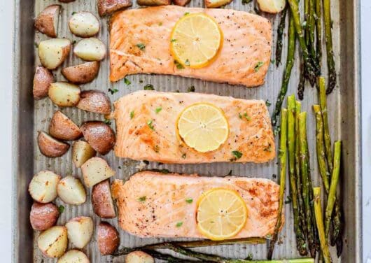 Salmon, potatoes and asparagus on sheet pan.