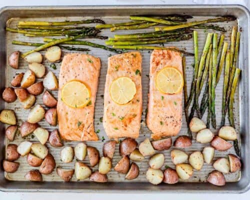 salmon, potatoes and asparagus on pan