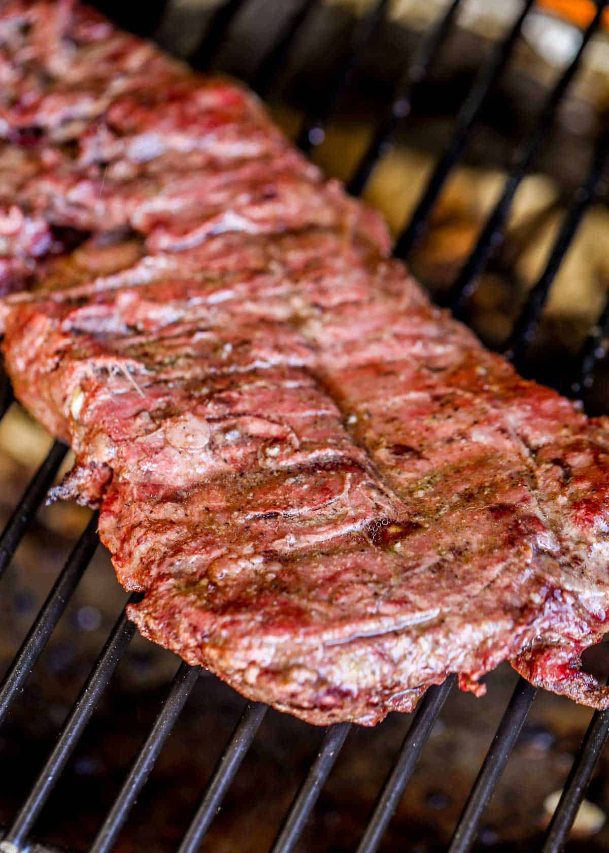 Skirt steak on grill.