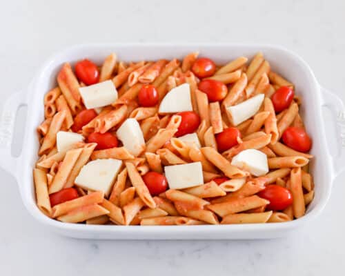 noodles, tomatoes and cheese in baking dish