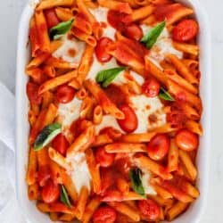 baked caprese pasta in white dish