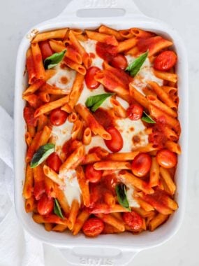 baked caprese pasta in white dish
