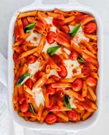 baked caprese pasta in white dish