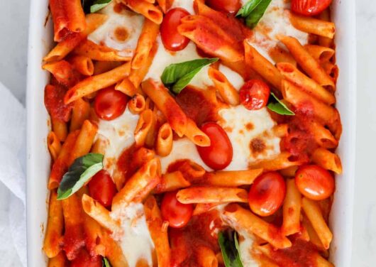 baked caprese pasta in white dish
