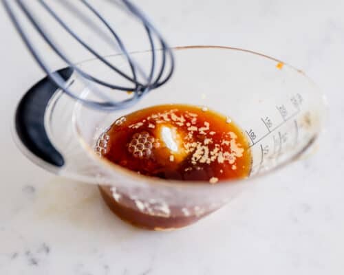 whisking cornstarch and sauce in cup