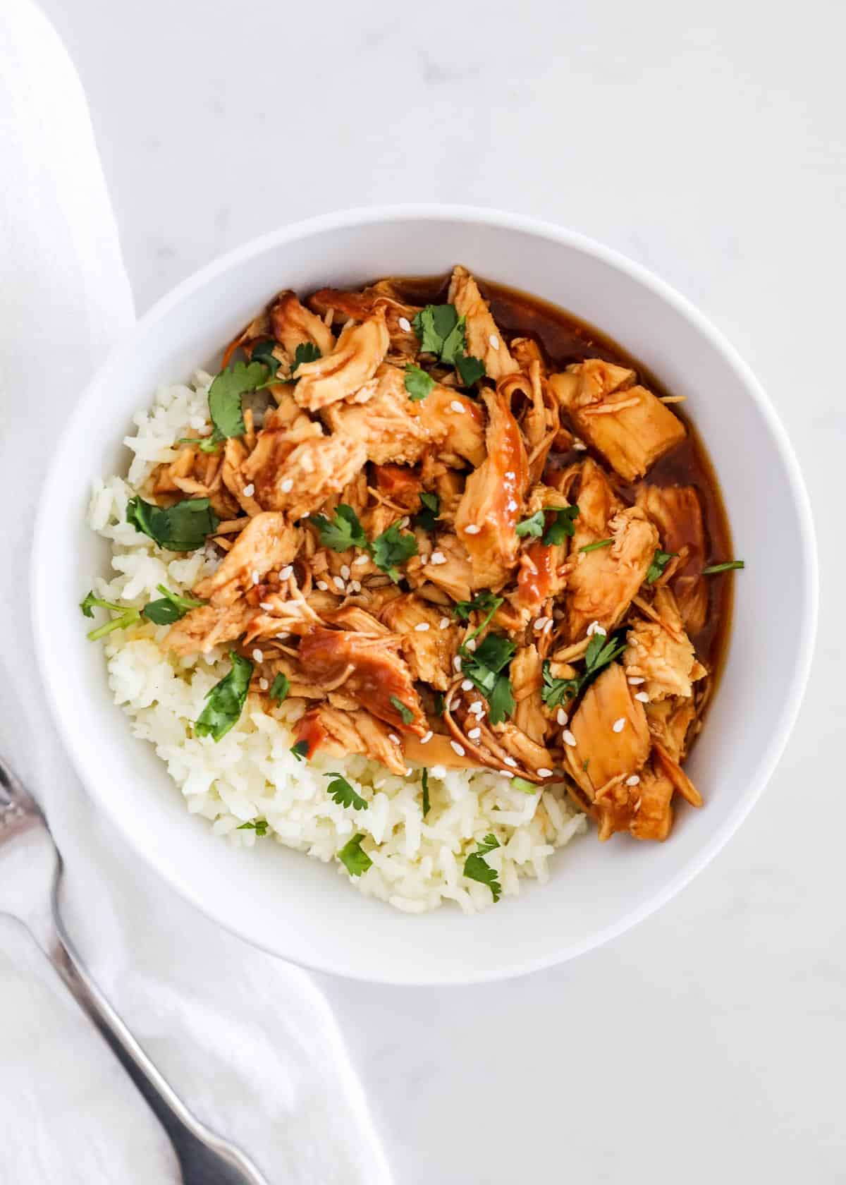 Teriyaki chicken and rice in bowl.