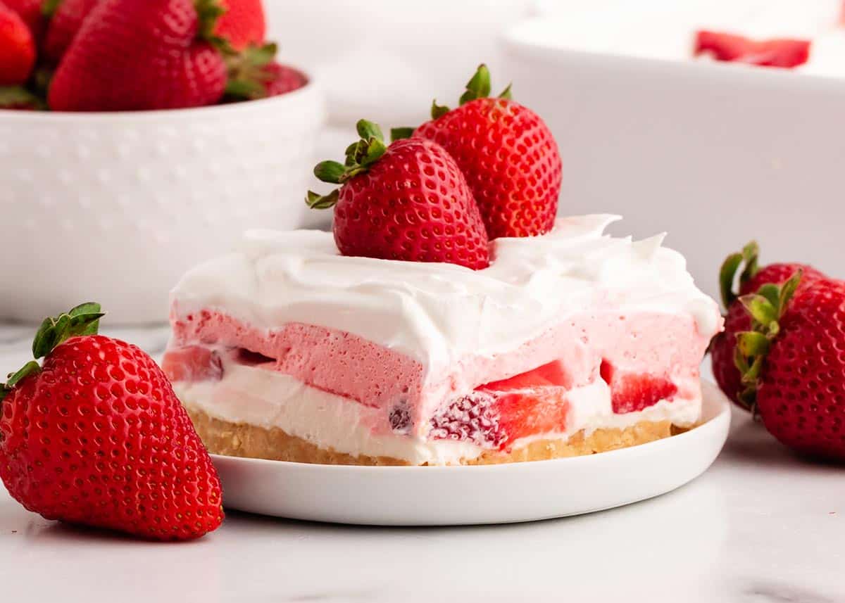 Strawberry lasagna on white plate.