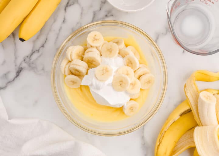 bananas and whipped cream in pudding