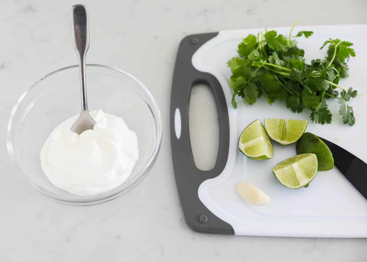 Cilantro lime crema ingredients on table.