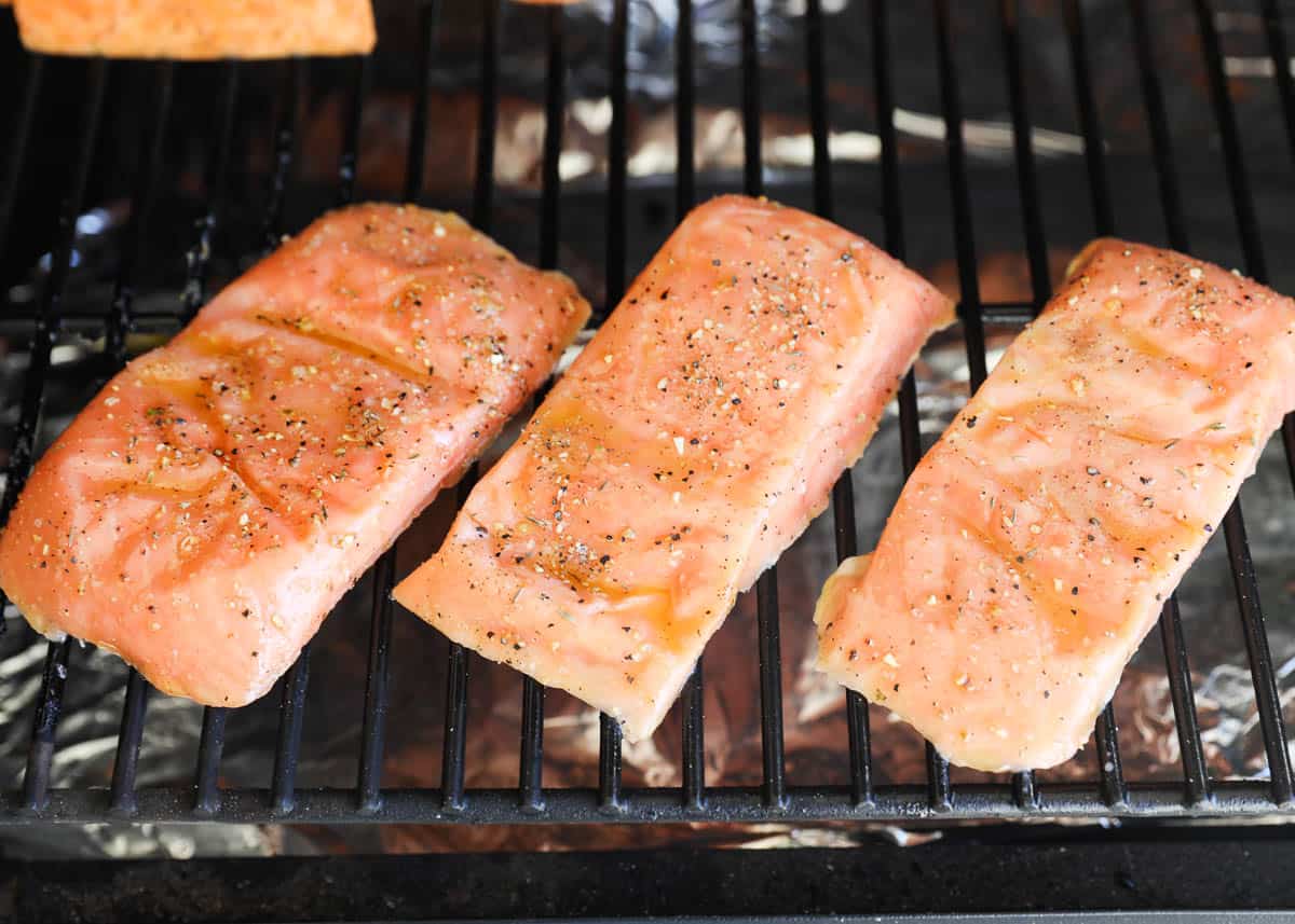Salmon cooking on grill.