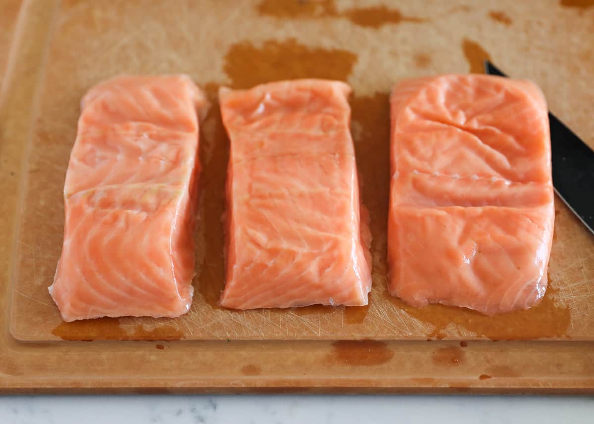 Salmon on cutting board.