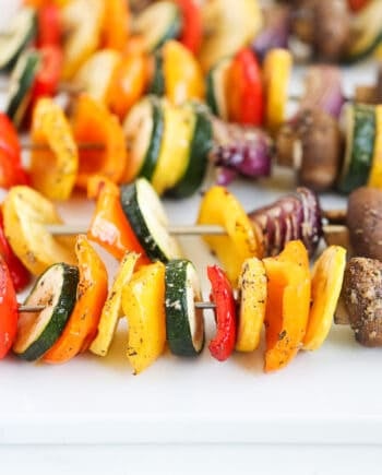 vegetable skewers on white platter