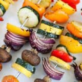 vegetable skewers on white platter