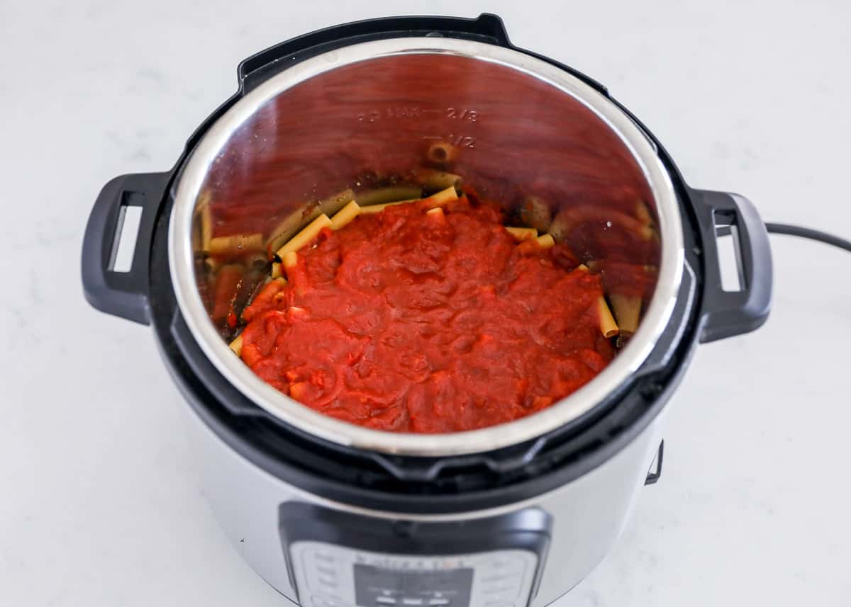 Sauce on top of noodles in instant pot.