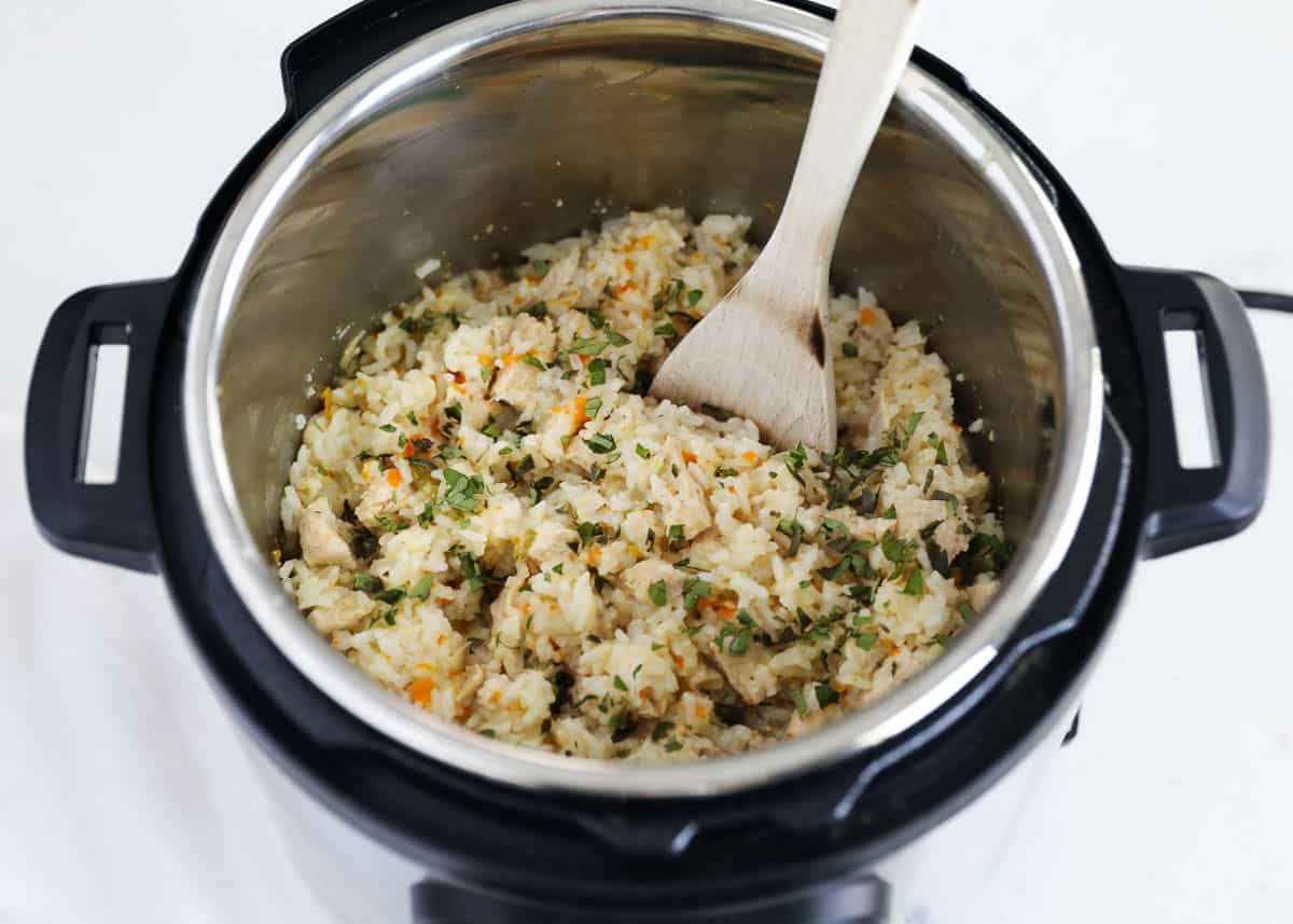 This super simple Instant Pot chicken and rice is your one-stop-shop for a flavorful, budget-friendly, complete family-friendly dinner idea that can even give you leftovers for the week! One-pot for easy clean-up is an added bonus! Chicken and rice in instant pot.