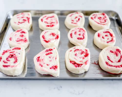 raspberry sweet rolls on pan before baking