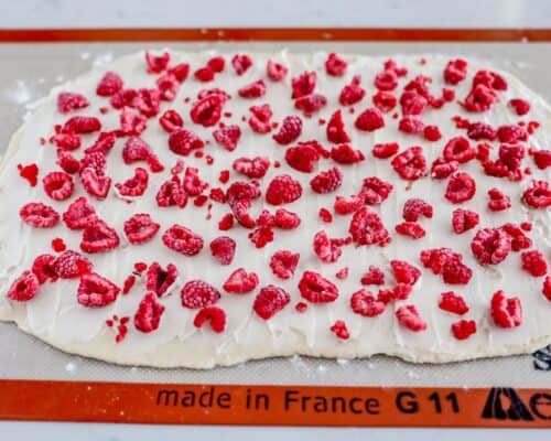 raspberries on top of dough