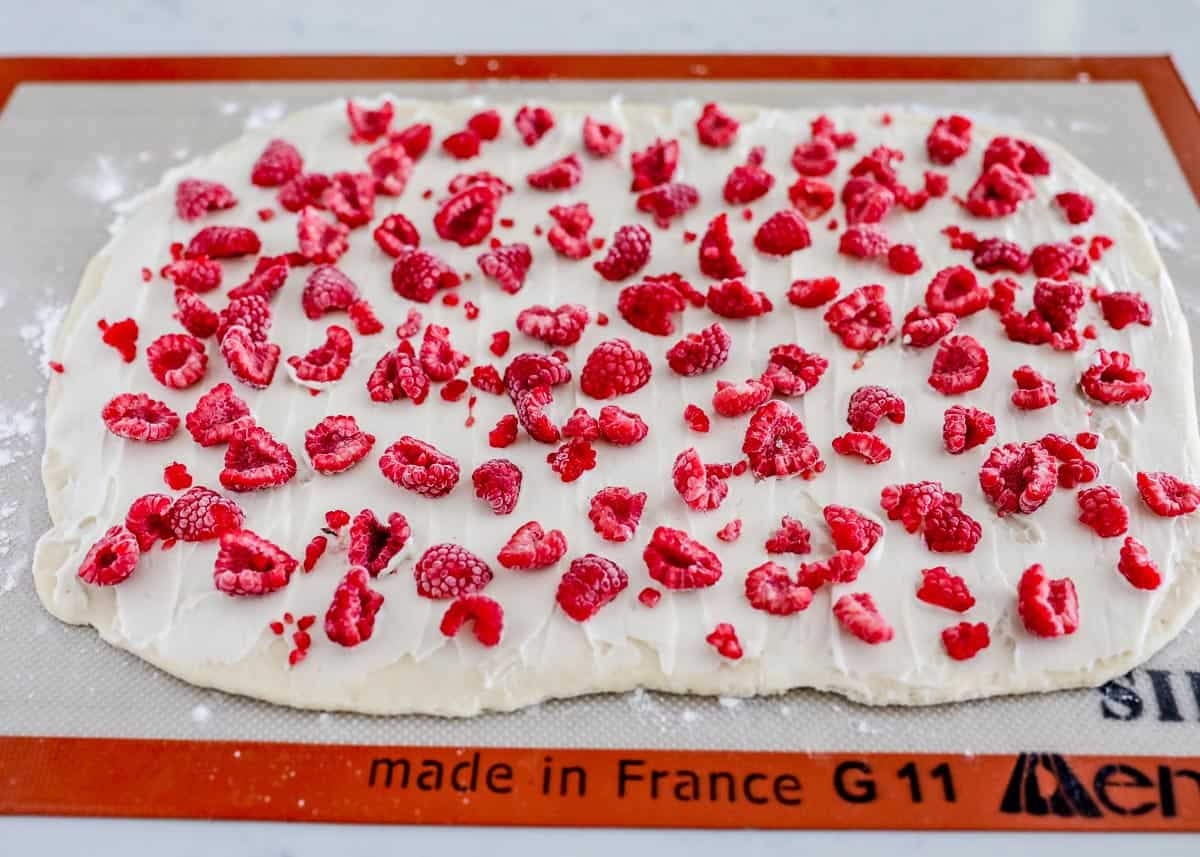 raspberries on top of dough