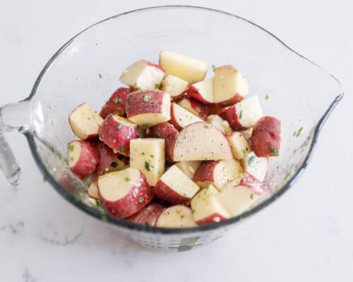 rosemary potatoes in glass bowl