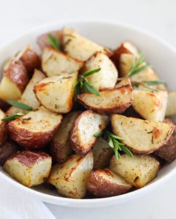 roasted potatoes in white bowl