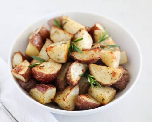 roasted potatoes in white bowl
