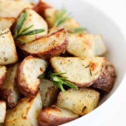 rosemary potatoes in white bowl