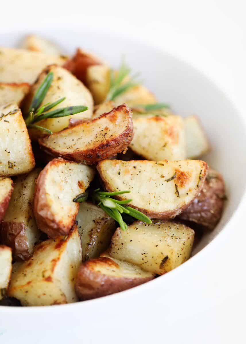 rosemary potatoes in white bowl