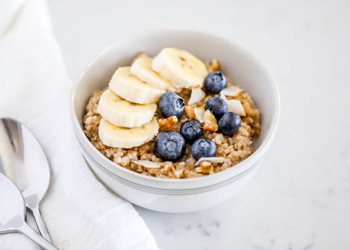 Bowl of steel cut oats with fruit.