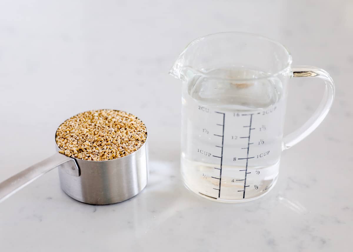 Steel cut oats and water on counter.